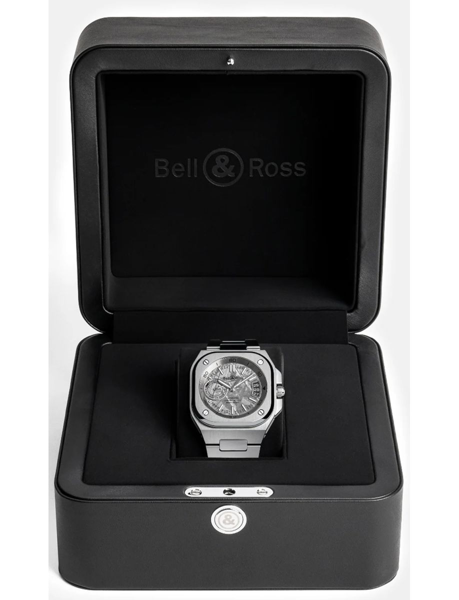 Bell & Ross stainless steel wristwatch in a black display box with the lid open, showing the engraved logo inside the top.