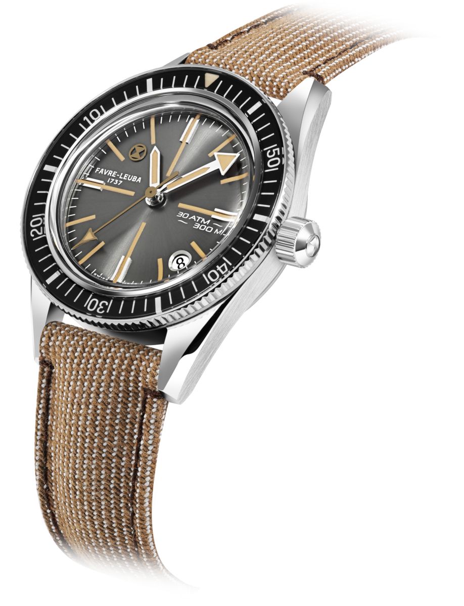 Wristwatch with a gray dial, black rotating bezel, and tan fabric strap on a white background.