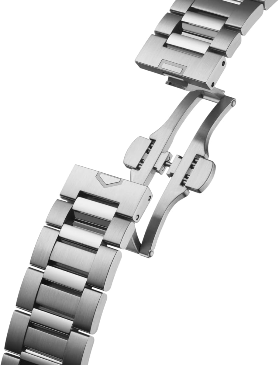 Stainless steel watch bracelet with a folding deployment clasp, shown at an angled view.