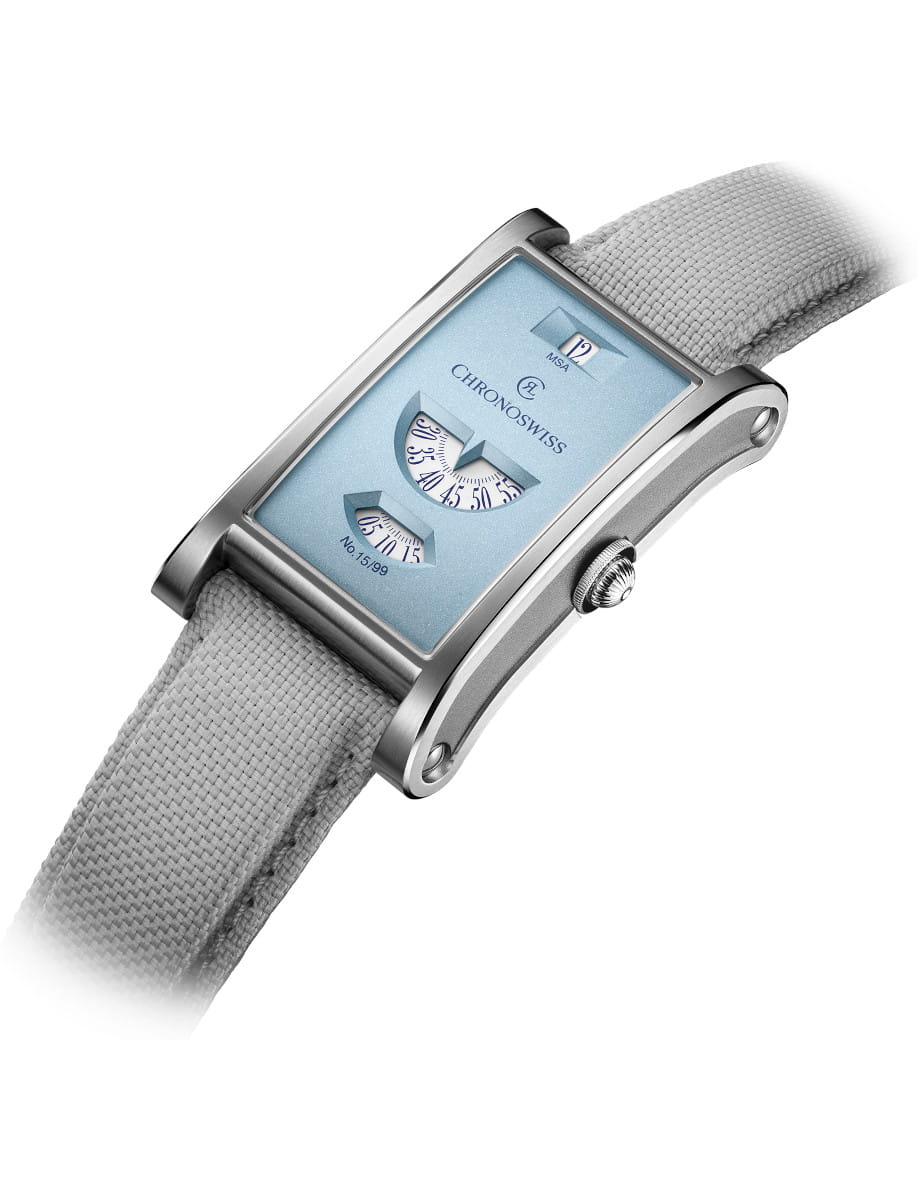 Chronoswiss rectangular wristwatch with a sky blue dial, dual retrograde displays, and a gray fabric strap.