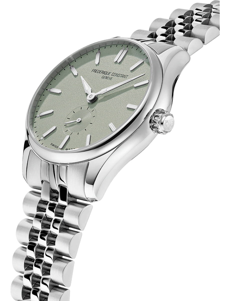 Close-up of a silver stainless steel wristwatch with a green textured dial, baton markers, and a polished link bracelet, shown at an angled perspective.
