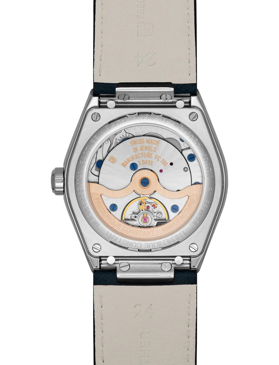 Transparent caseback of Frederique Constant automatic wristwatch showing the rotor and movement, with engravings and blue screws visible inside the mechanism.