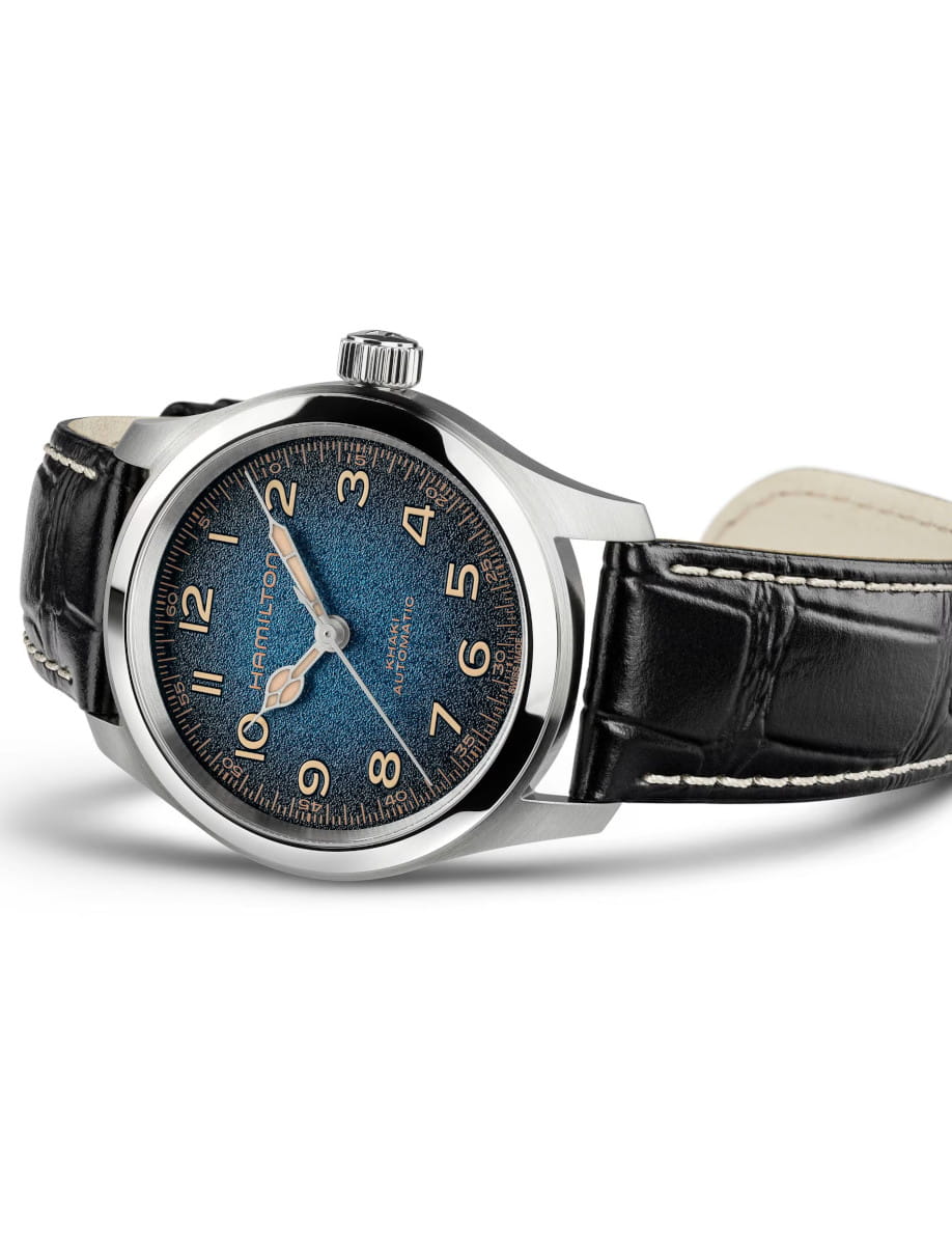 Hamilton wristwatch with a blue textured dial, stainless steel case, and black leather strap.
