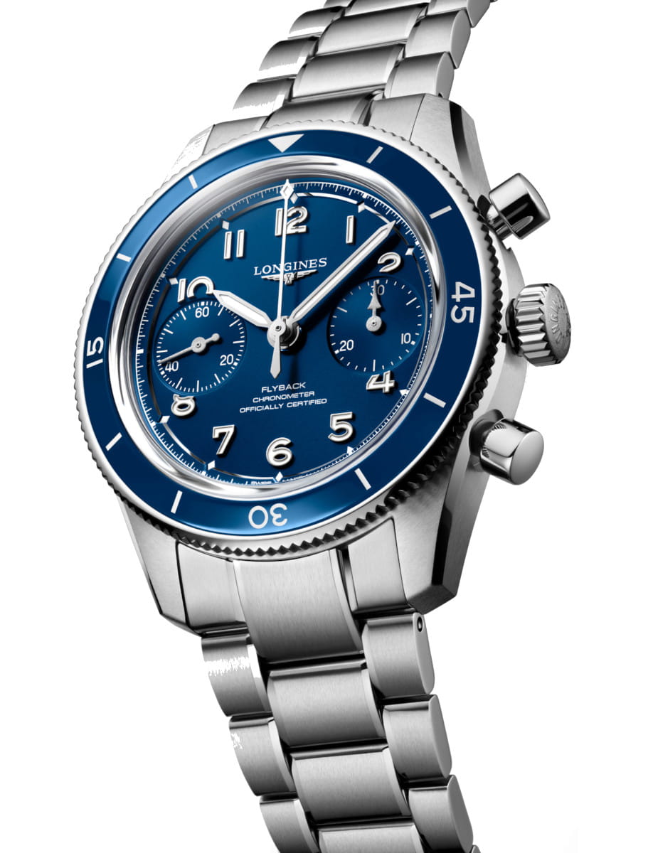Side view of Longines wristwatch with stainless steel case and bracelet, ceramic bezel and blue dial.