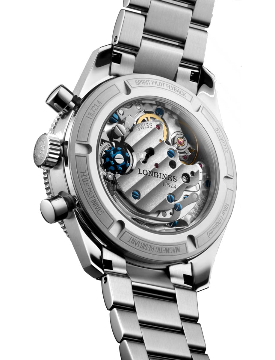 Stainless steel Longines wristwatch viewed from the back, exposing the mechanical movement through a transparent case back.