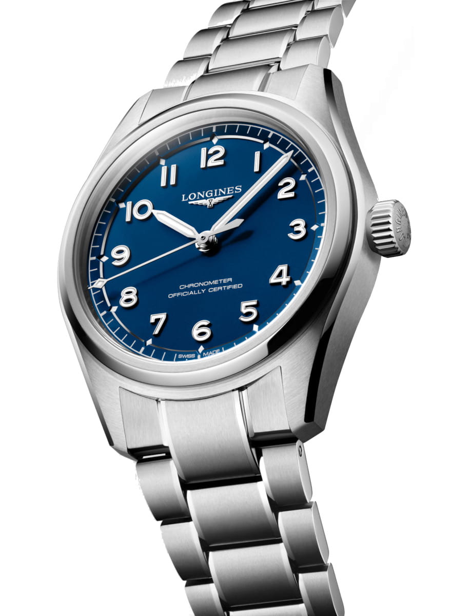 Side view of Longines wristwatch with stainless steel case and bracelet, and blue dial.