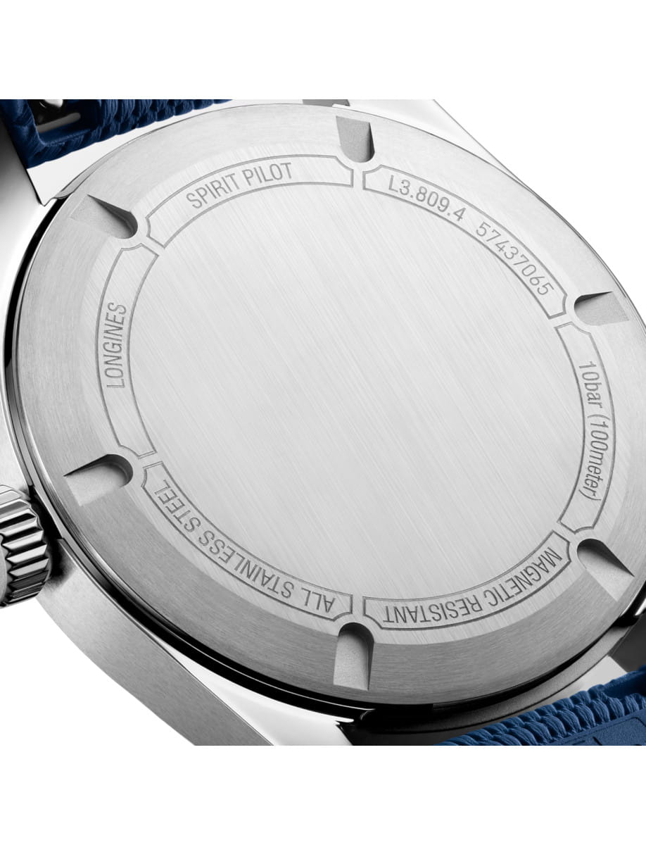 Close-up of a stainless steel watch back with engraved text: SPIRIT PILOT, LONGINES, ALL STAINLESS STEEL, MAGNETIC RESISTANT.