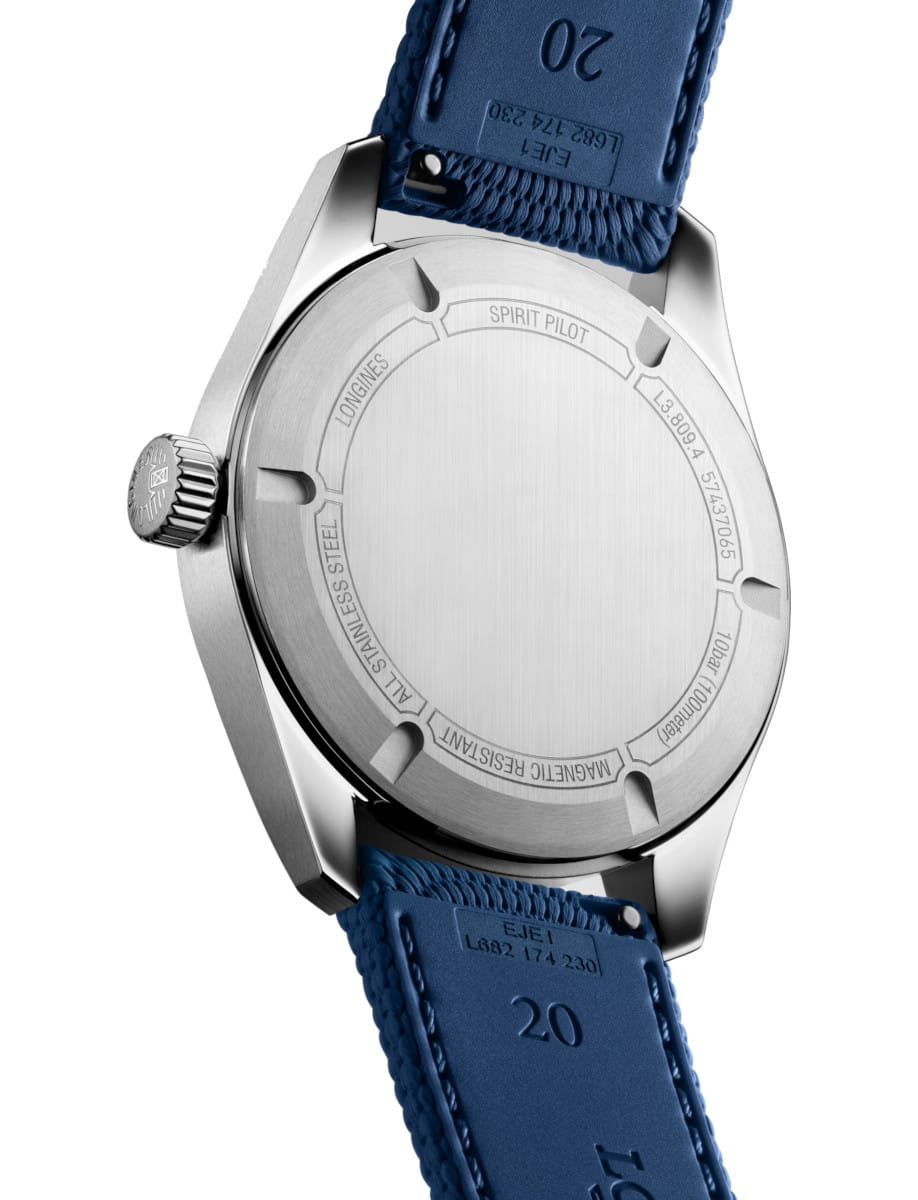 Stainless steel watch back with engraved text and a blue strap, showing crown on the left side.
