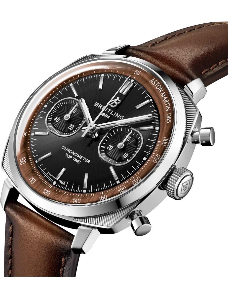 Breitling chronograph watch with black dial, brown bezel, and brown leather strap (close-up)