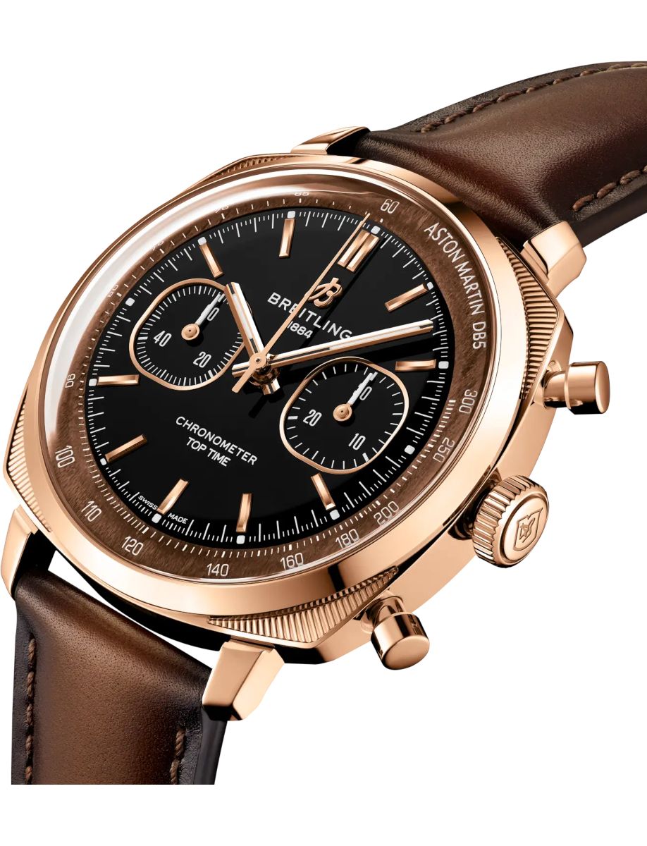 Rose-gold Breitling chronograph watch with black dial, three subdials, and brown leather strap