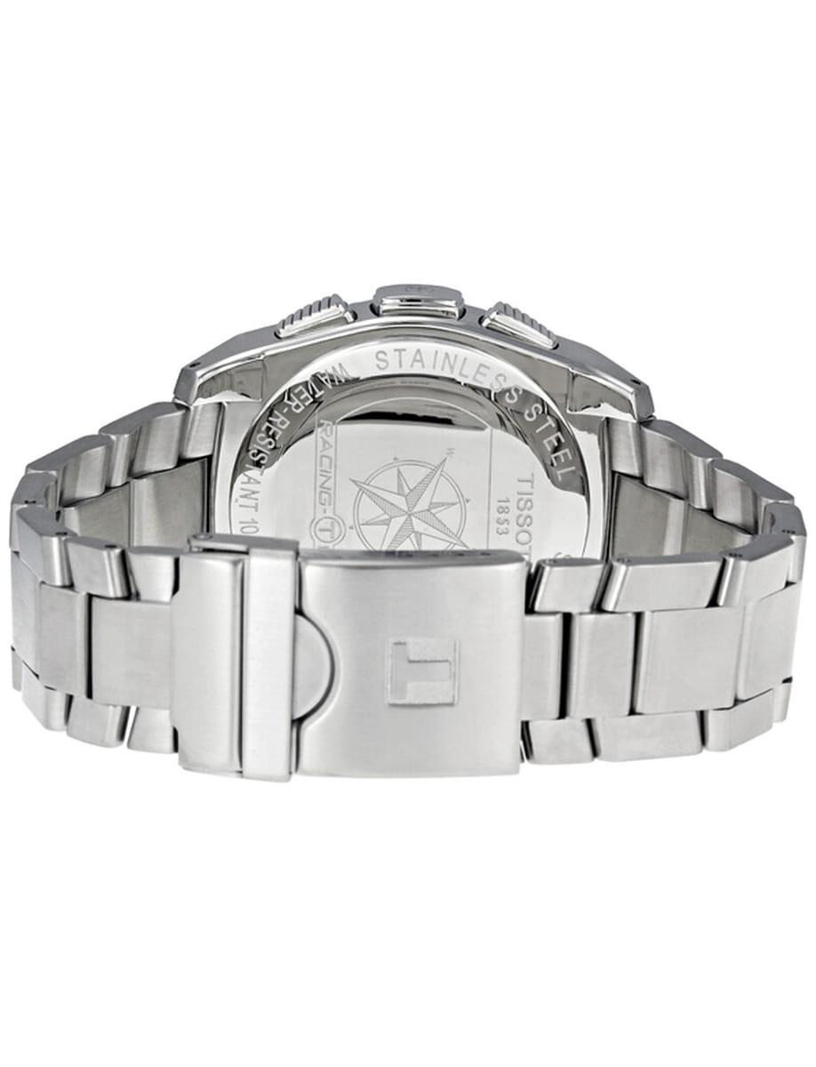Close-up of a stainless steel wristwatch with a metal link bracelet and a deployment clasp, showing the engraved back case.