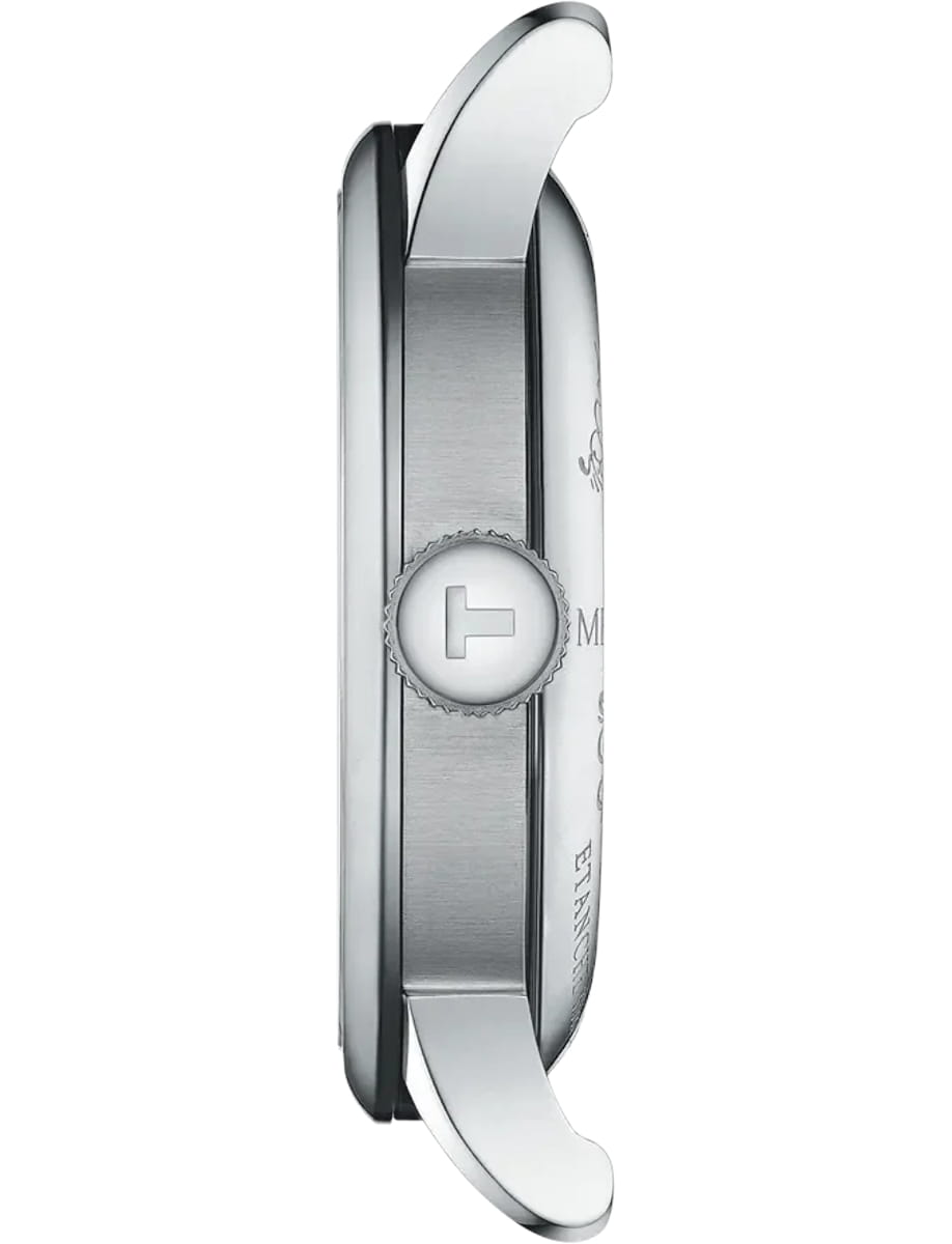 Side view of a silver wristwatch case with a knurled crown featuring a raised 'T' emblem.
