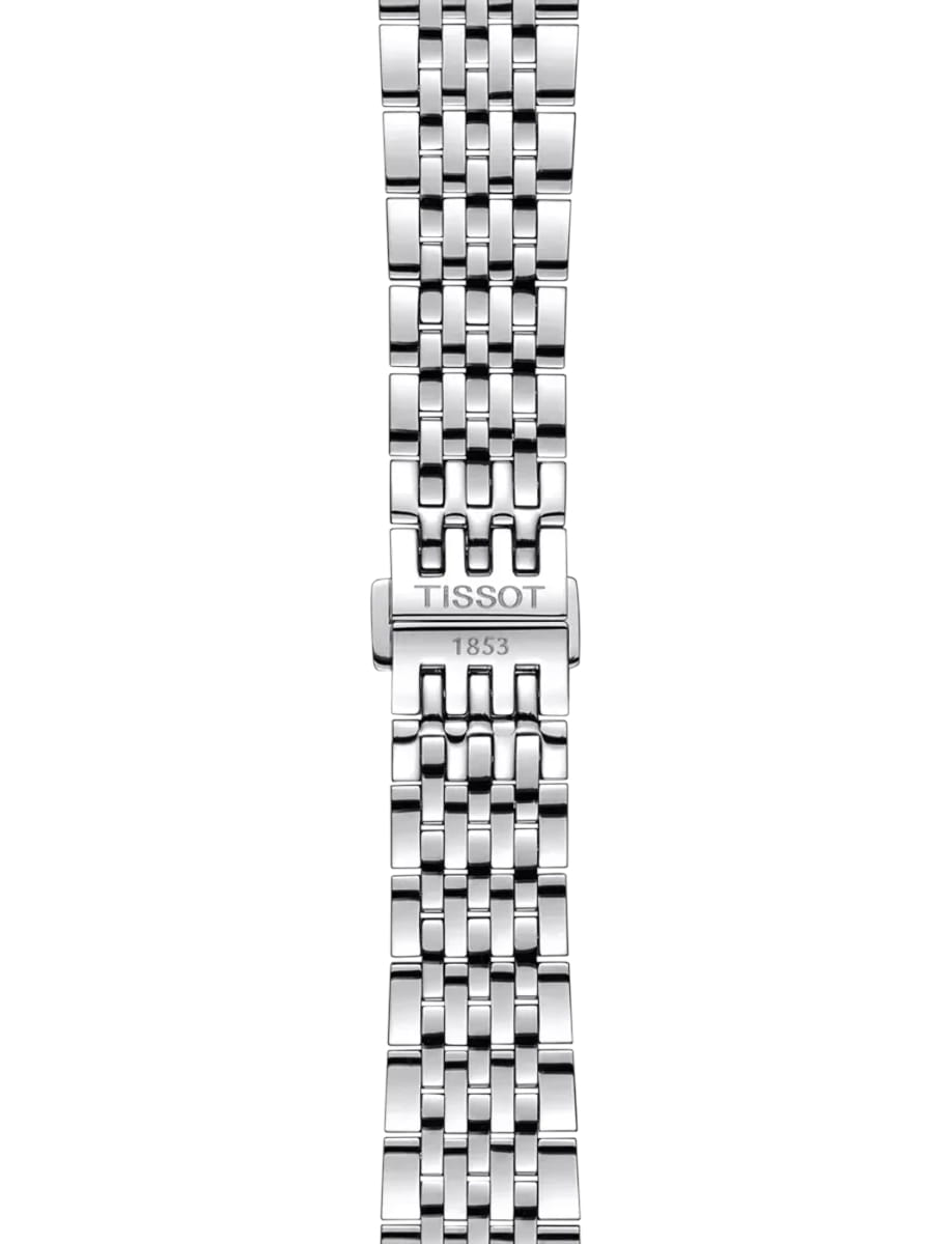Close-up of a silver stainless steel watch bracelet with a TISSOT clasp engraved 'TISSOT 1853'
