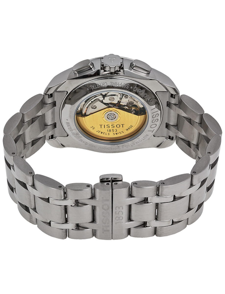 Stainless steel Tissot watch with a transparent case back revealing the gold-toned movement and bracelet links