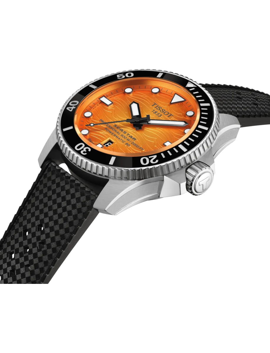 Orange-dial dive watch with a black bezel, silver case, and black textured strap, showing Tissot branding.
