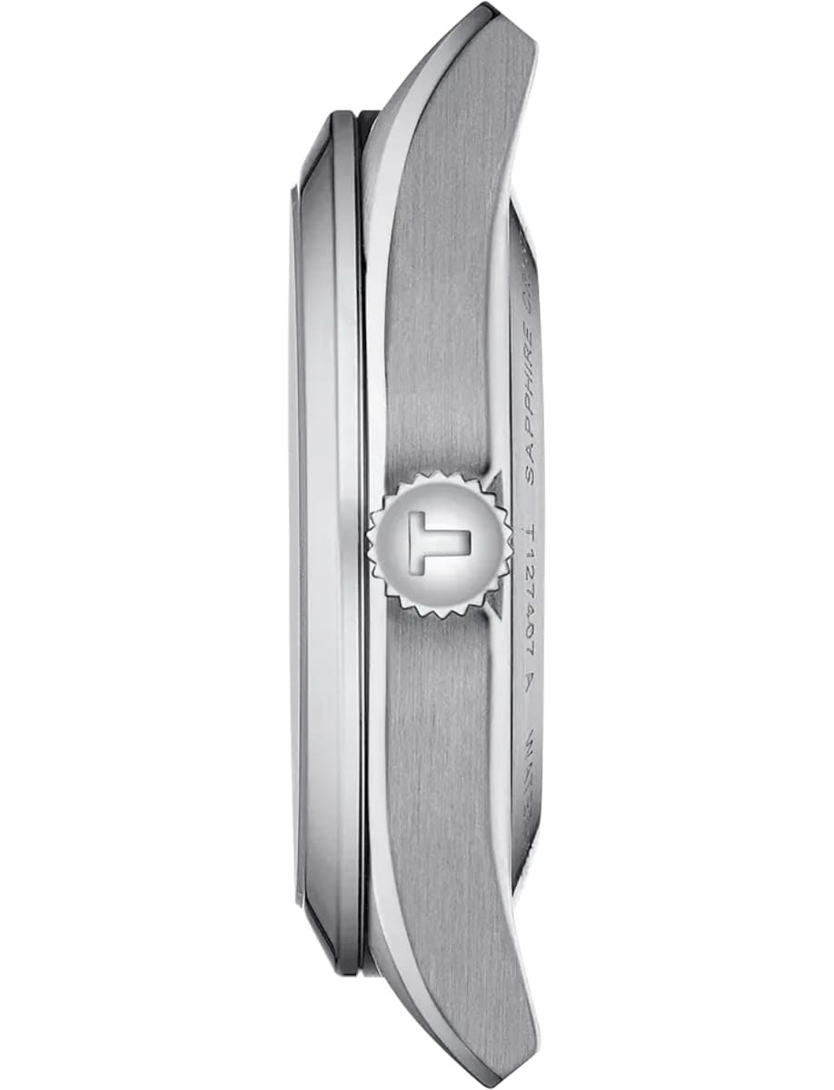 Side profile of a stainless steel wristwatch, highlighting the knurled crown and curved case edge