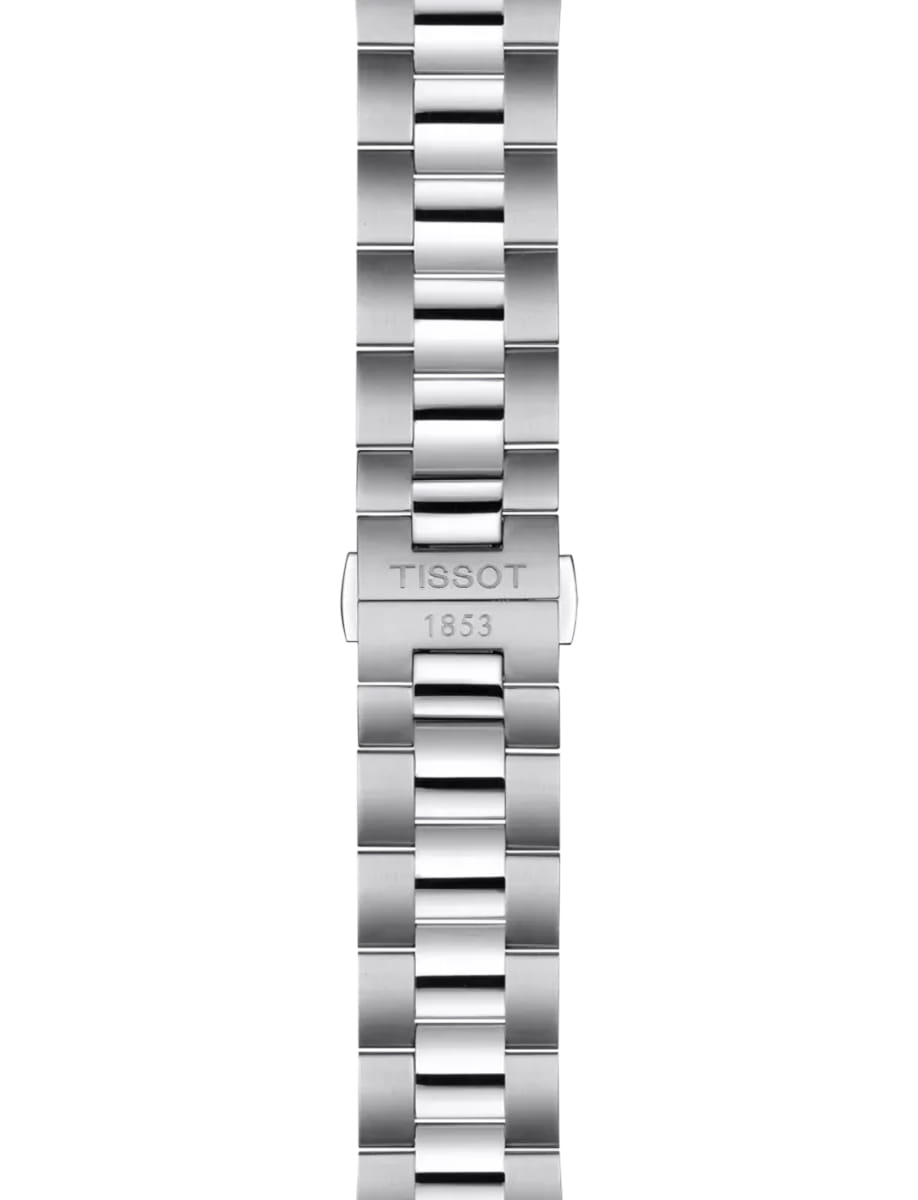 Close-up of a stainless steel watch bracelet with a deployant clasp engraved 'TISSOT 1853'.