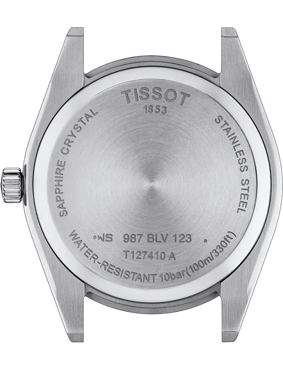 Back of a stainless steel Tissot wristwatch showing engraved text: sapphire crystal, water resistance up to 100 meters, and model/serial markings; crown visible on the left side.