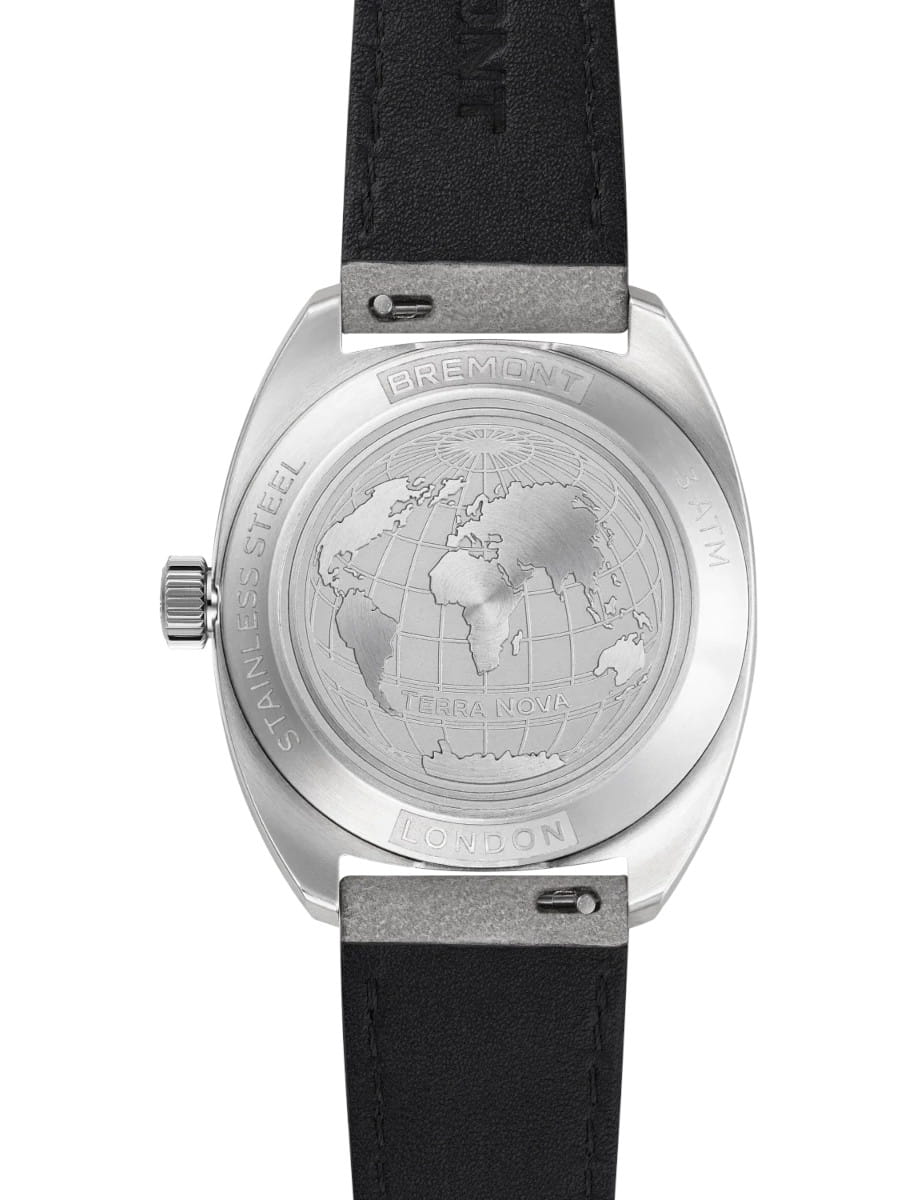 Stainless steel watch case back with an engraved world map and Terra Nova London branding, attached to a black leather strap.