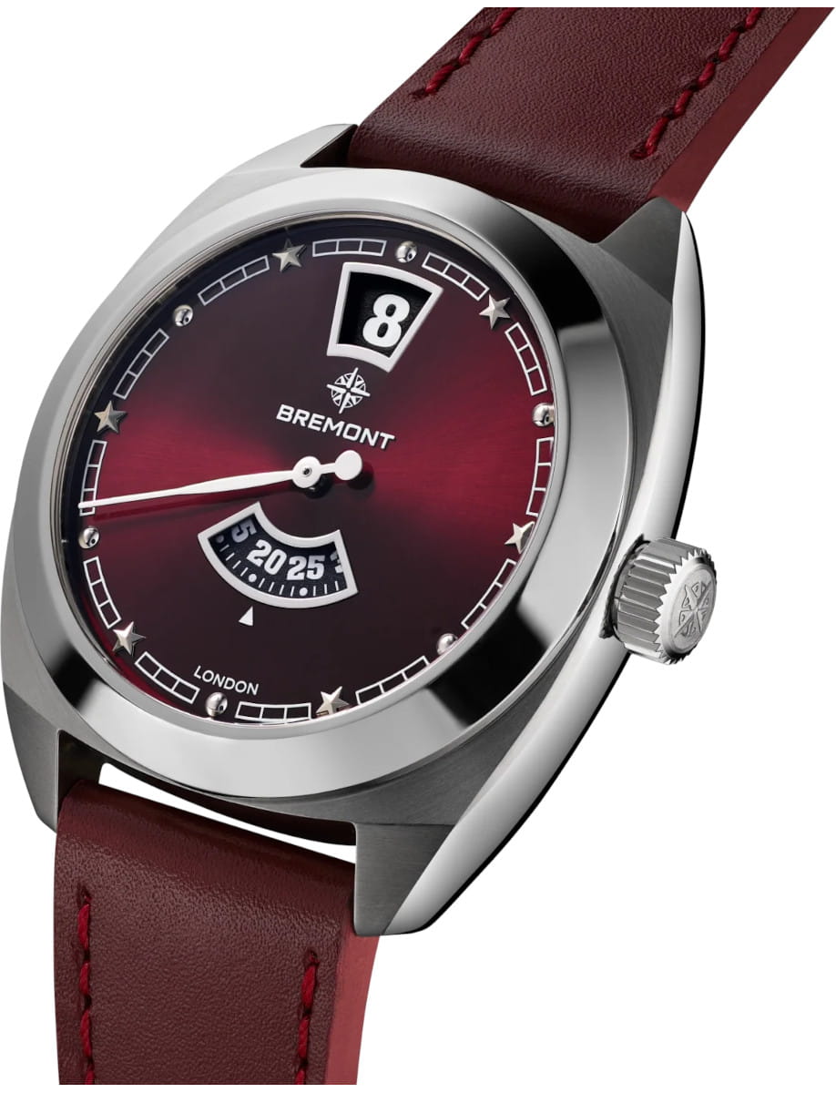 Close-up of a Bremont wristwatch with a burgundy dial, stainless steel case, and burgundy leather strap.