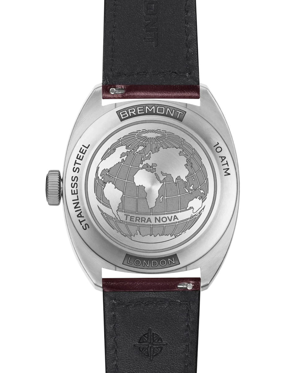 Bremont watch back with globe engraving, stainless steel case, and London label; strap attached.