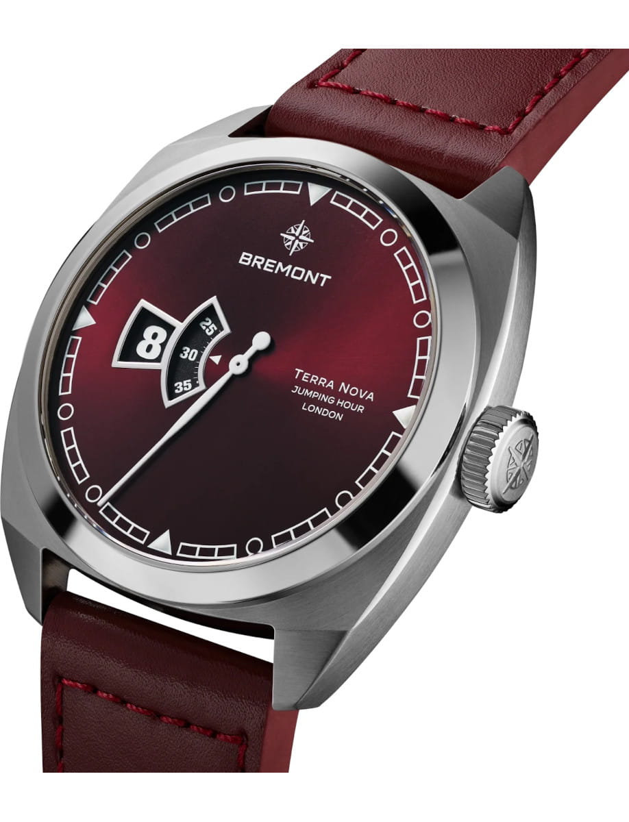 Bremont Terra Nova wristwatch with a burgundy dial, silver case, and red leather strap.