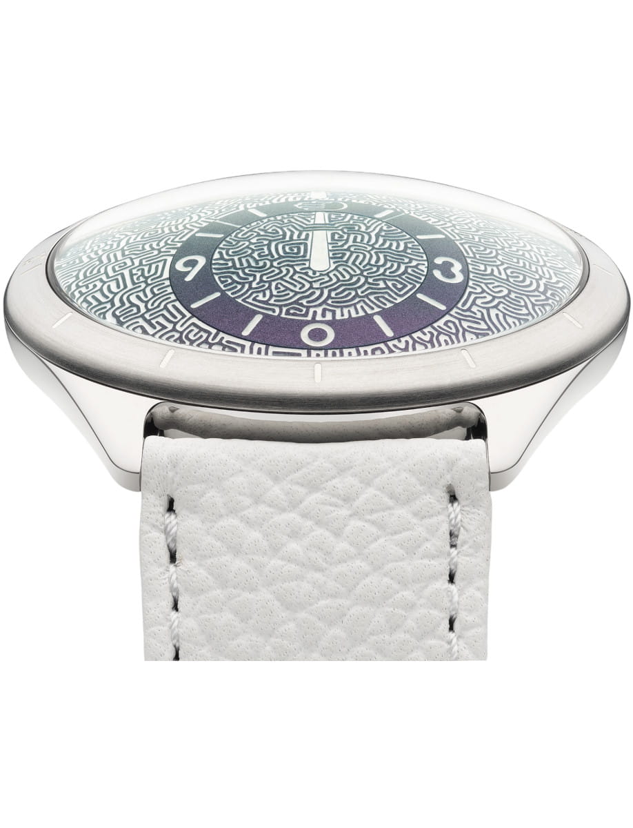 Close-up of a Ressence wristwatch with Grade 5 Titanium case, Emerald green dial, and white calf leather strap.