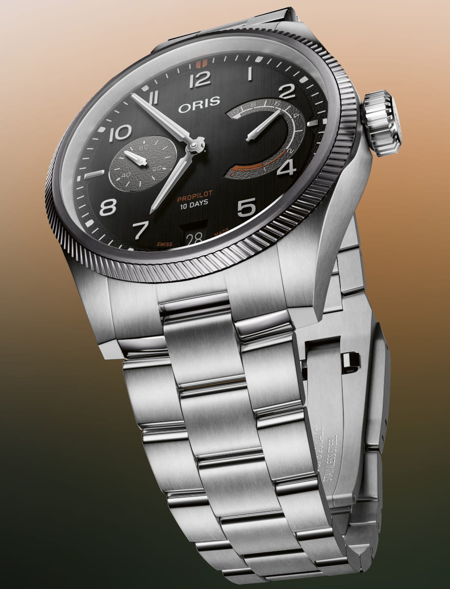 Stainless steel Oris wristwatch with black dial and chronograph, showing a stainless steel bracelet