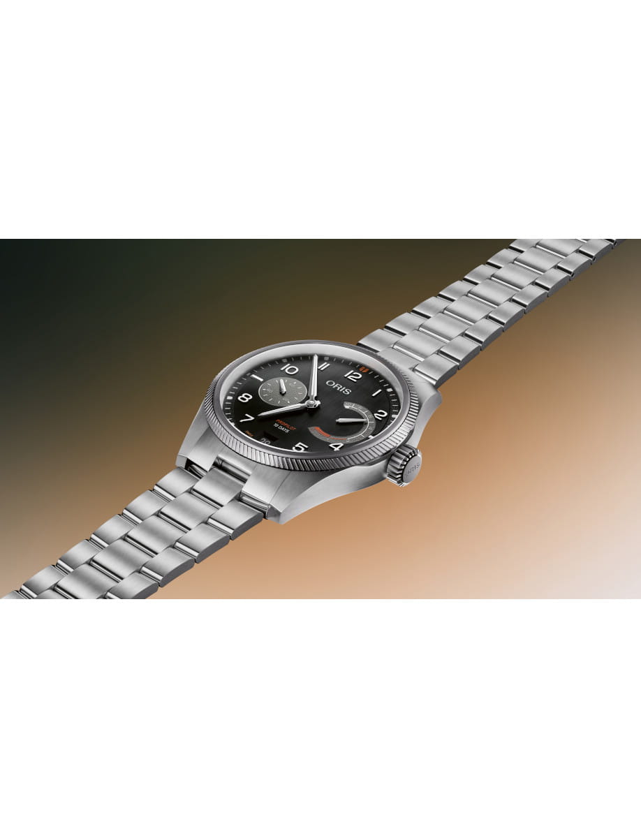 Stainless steel wristwatch with a black dial and silver subdials, angled to showcase the bracelet.