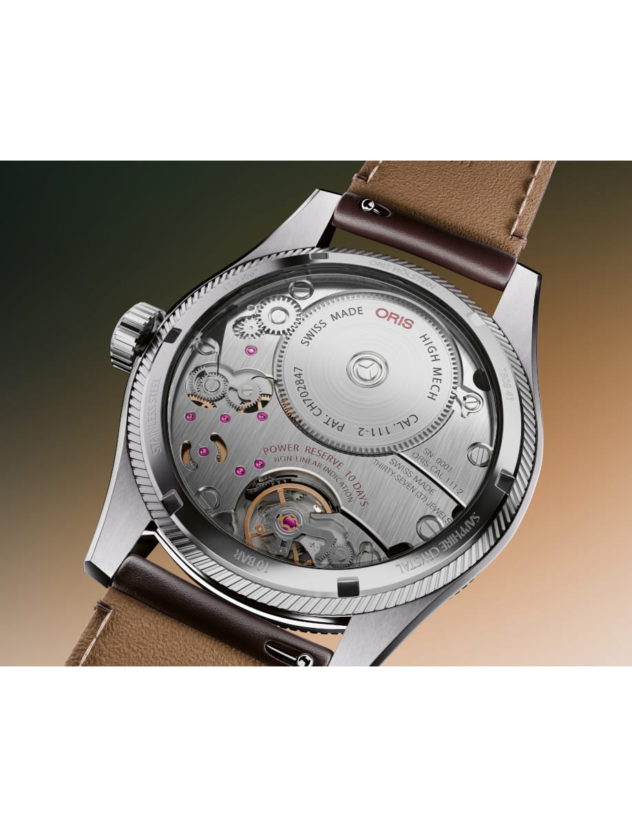 Back of a stainless steel Oris watch showing the mechanical movement through a transparent case back with gears and ruby jewels, brown leather strap