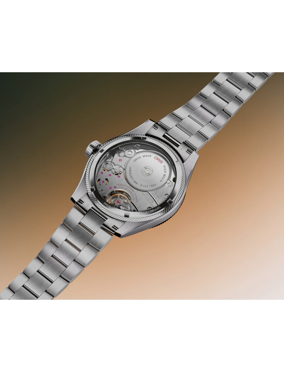 Stainless steel wristwatch with a transparent case back showing the inner gears and rotor.