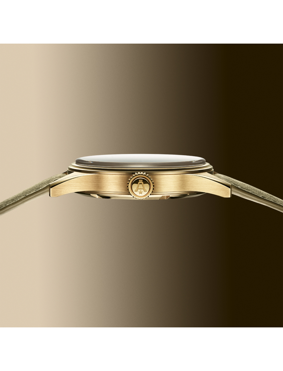 Side view of Angélus chronograph watch with 18k yellow gold case, and sage green calfskin leather strap.