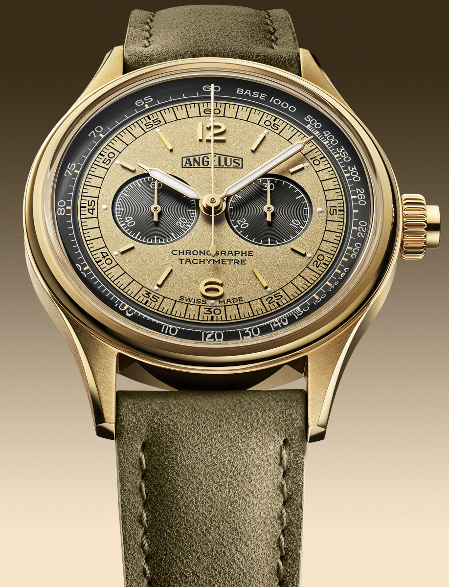 Close-up view of Angélus chronograph watch with 18k yellow gold case, yellow and green dial, tachymeter scale, and sage green calfskin leather strap.