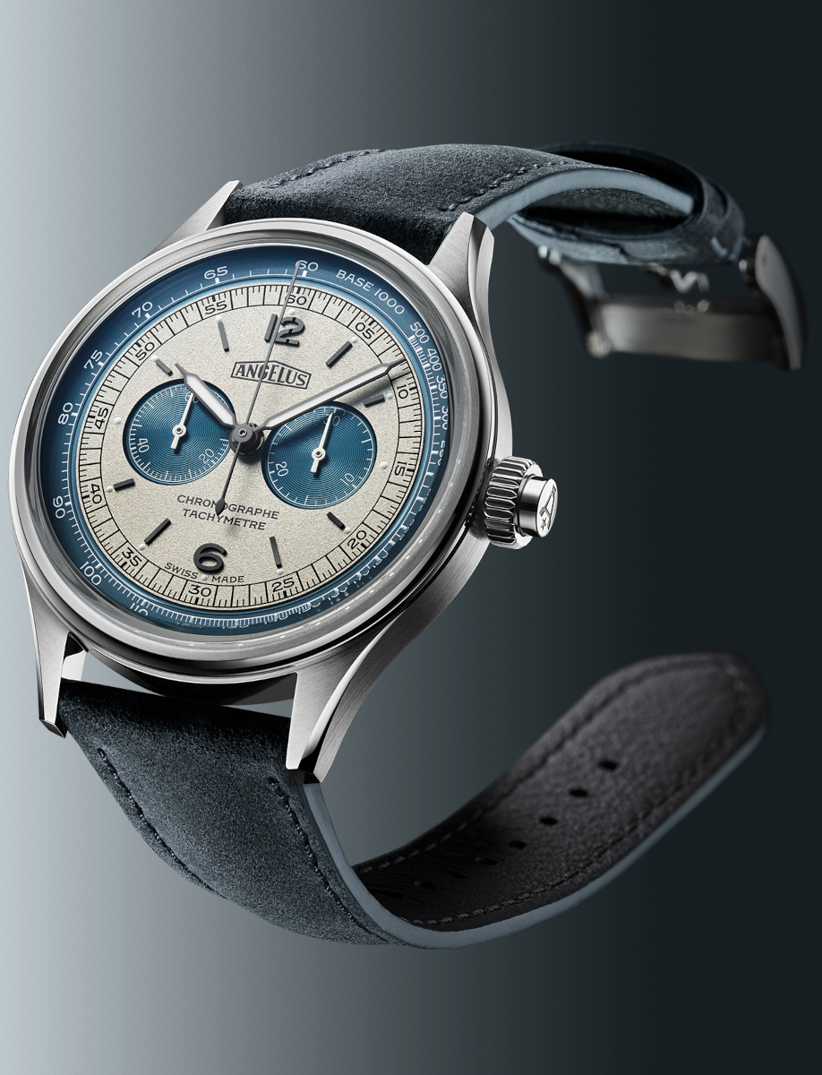 Side view of Angélus chronograph watch with stainless steel case, blue and grey dial, tachymeter scale, and blue calf leather strap.