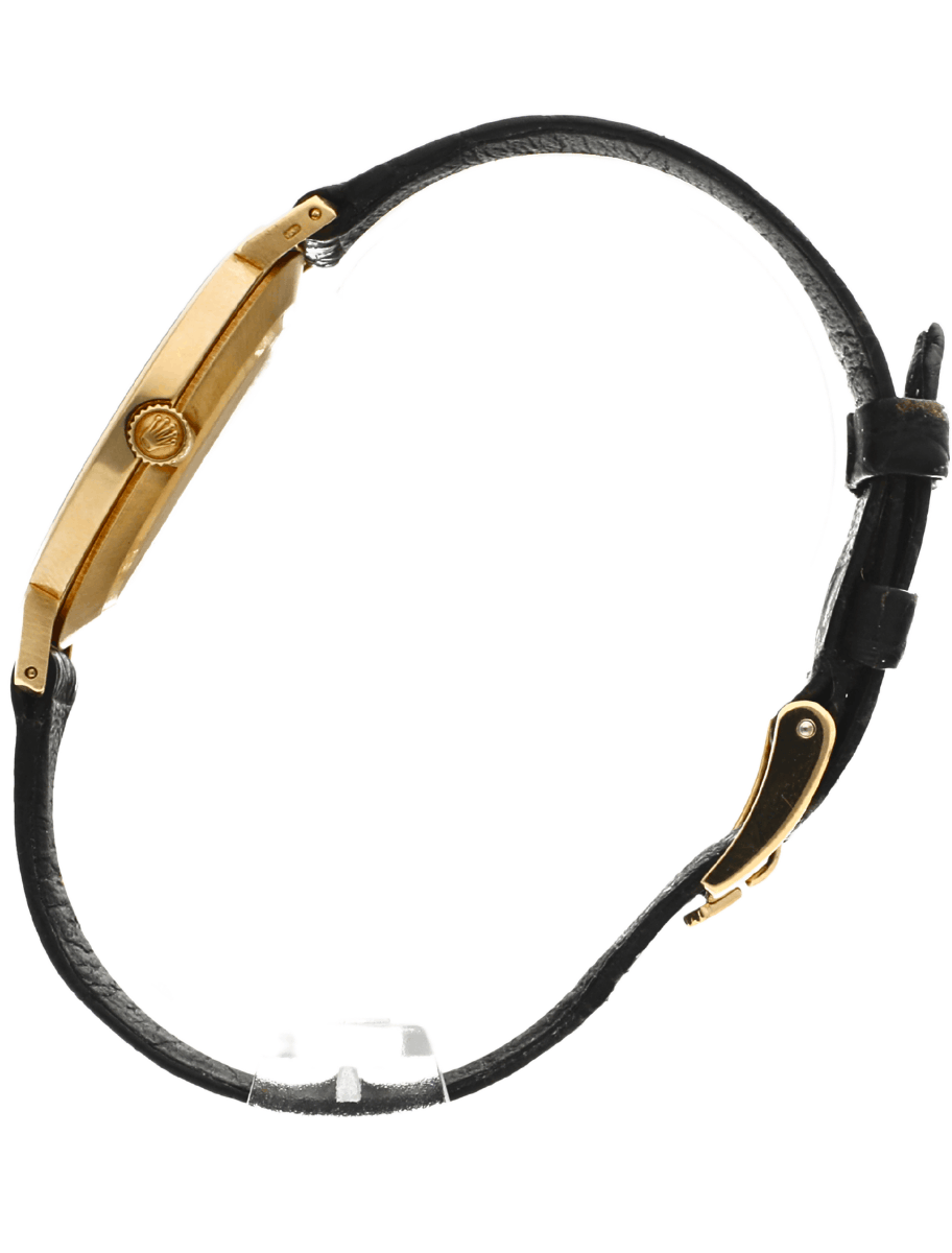 Side view of pre-owned Rolex wristwatch with yellow gold case and dial, and black alligator leather strap.