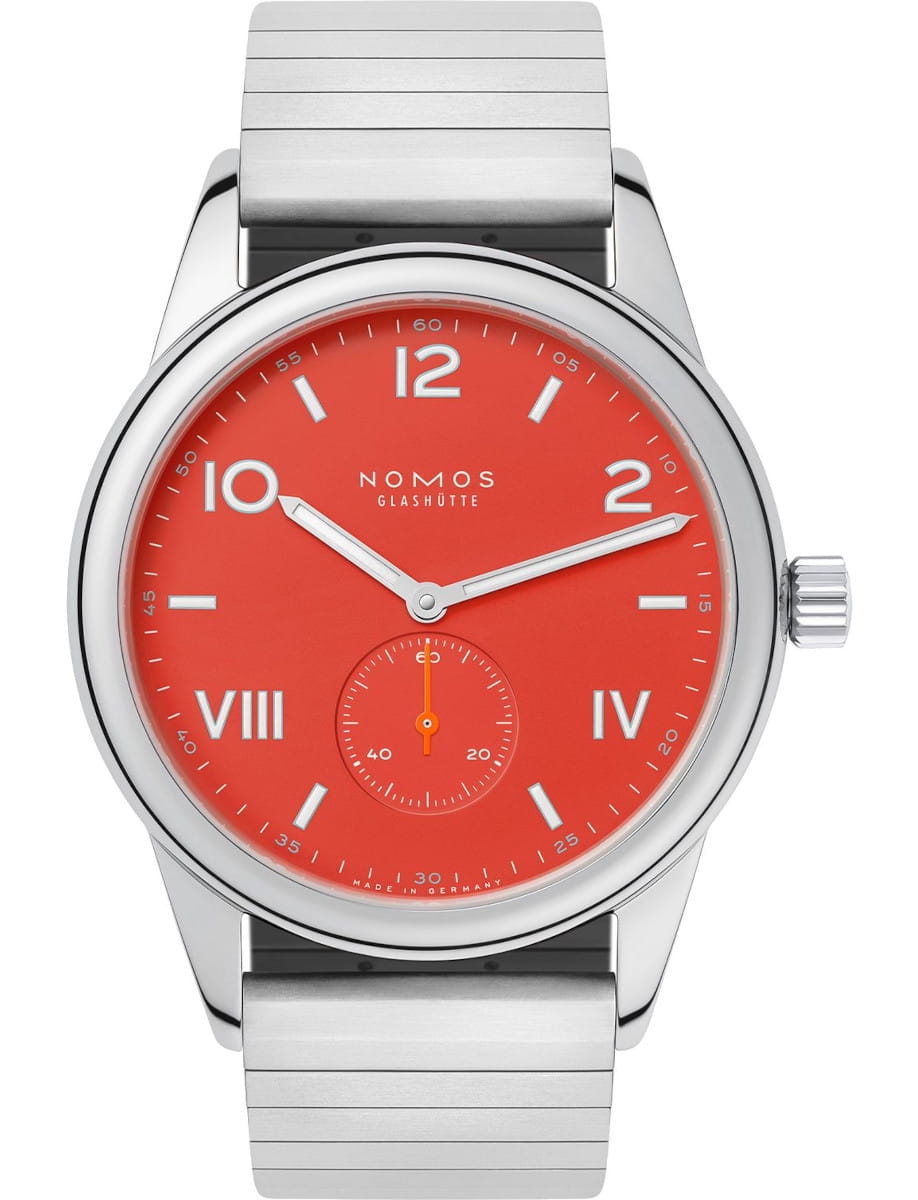 Nomos wristwatch with stainless steel case, red dial, and stainless steel bracelet.