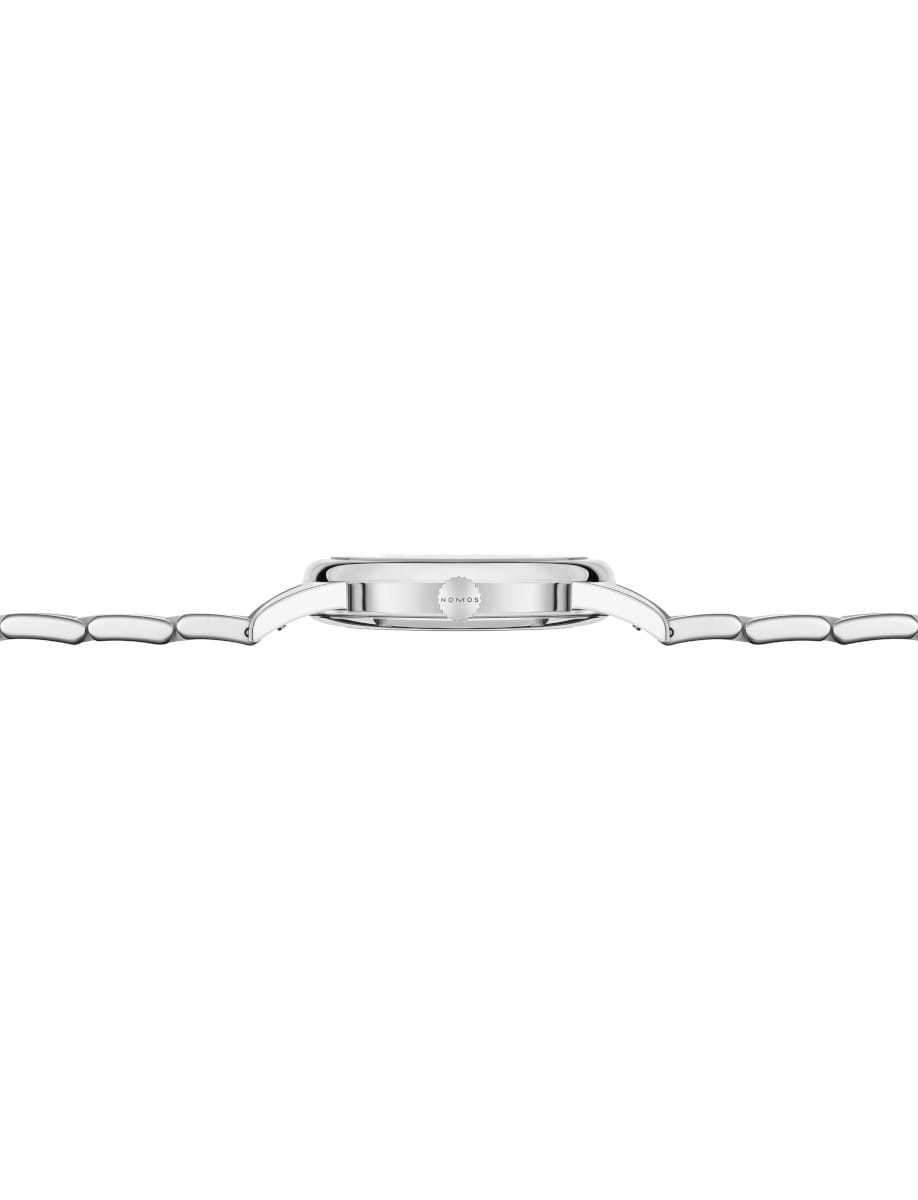 Side view of a stainless steel wristwatch with a black leather strap, showing the slim profile and crown on the side.