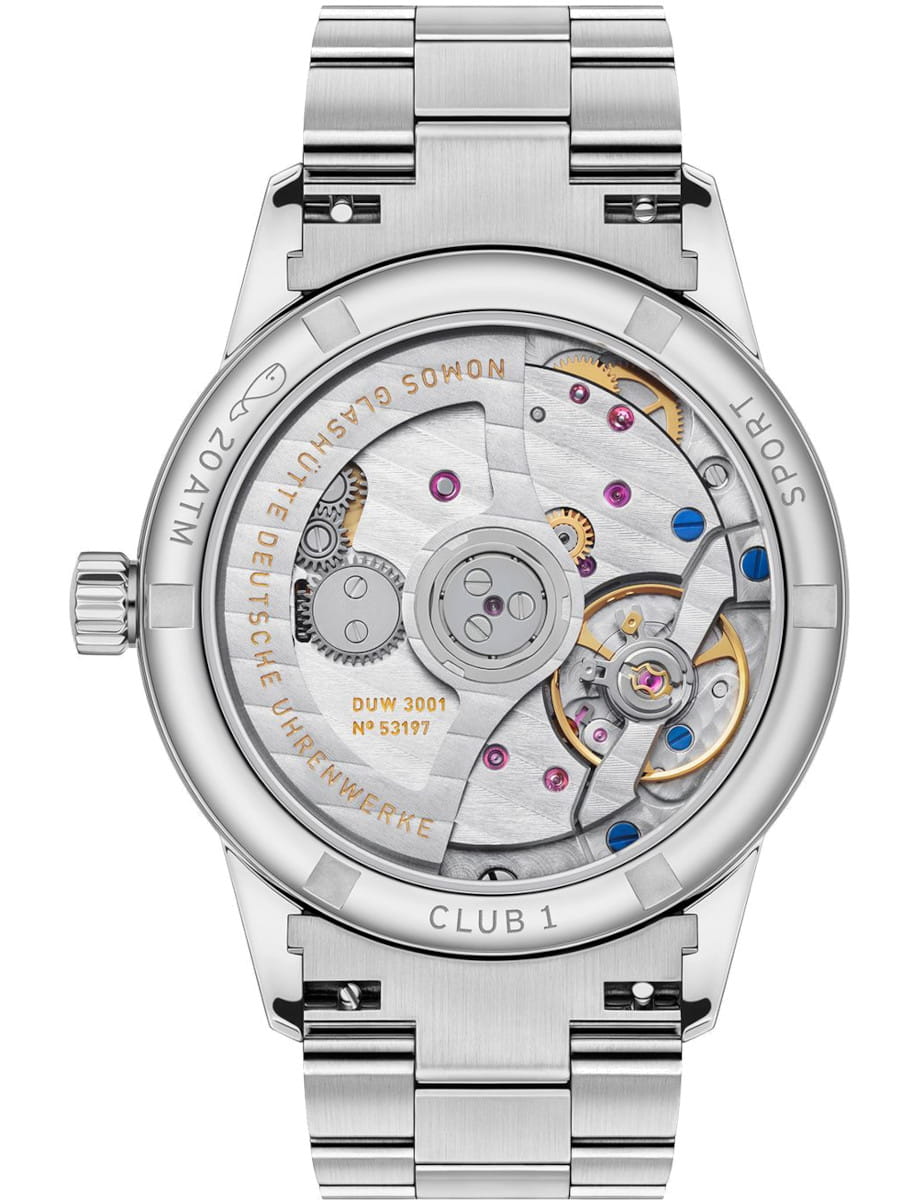 Back view of a Nomos stainless steel wristwatch with an exhibition case back, revealing the intricate mechanical movement, gears, screws, and a gold balance wheel.