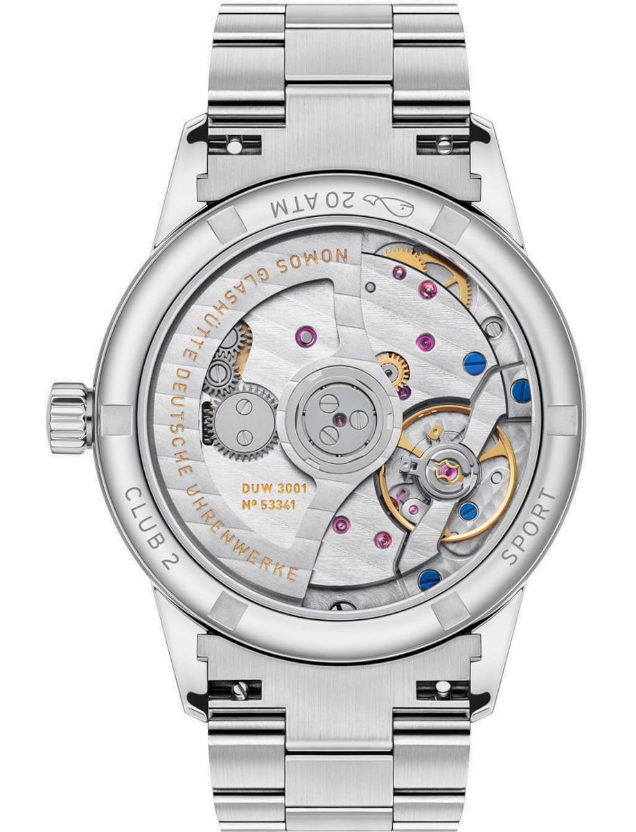 Close-up of a stainless steel wristwatch showing its exhibition case back with gears, jewels, and rotor visible inside the movement.