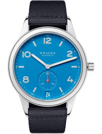 Nomos Club wristwatch with stainless steel case, blue-black textile strap, and siren blue dial.