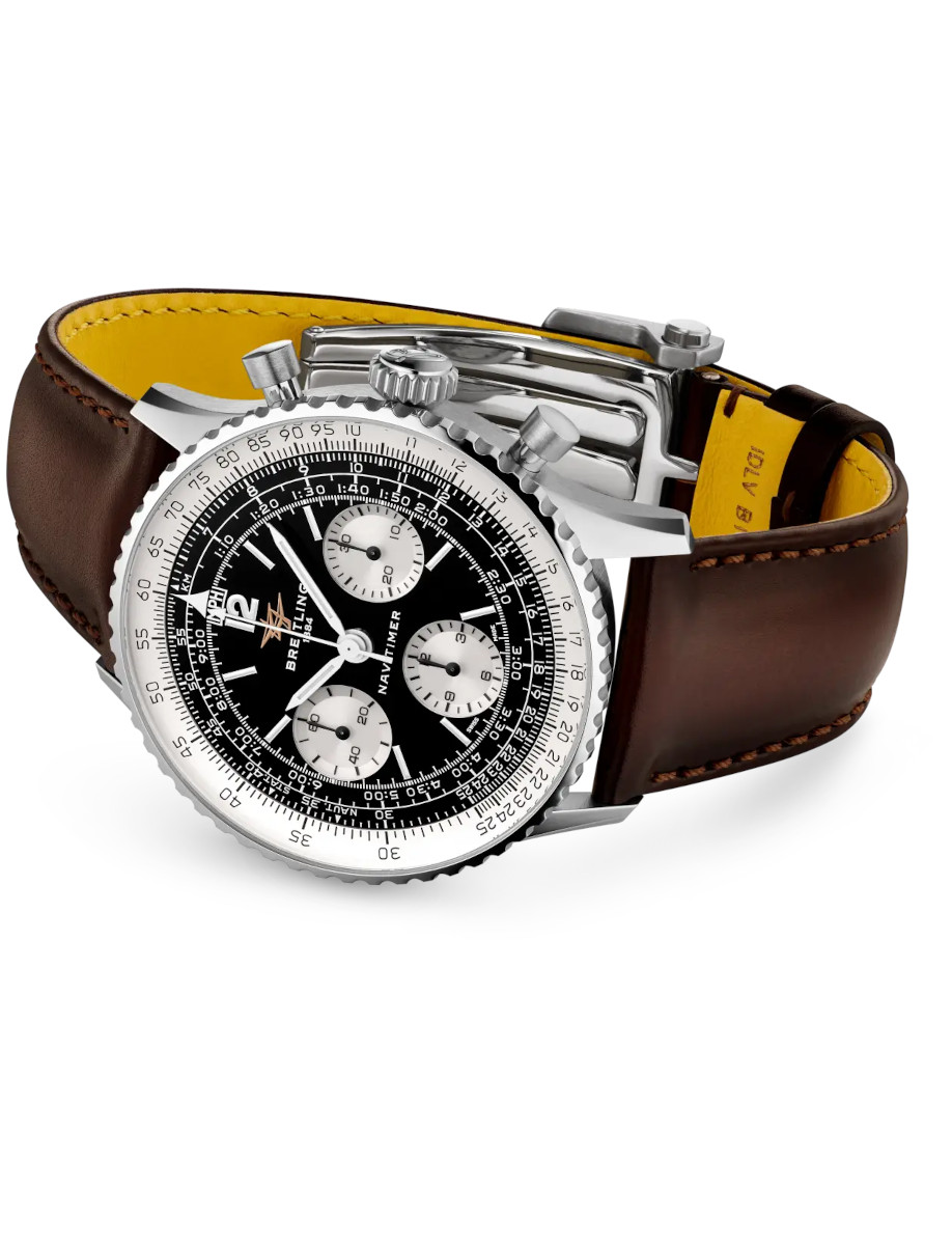 Side view of Breitling Navitimer wristwatch with stainless steel case, gold Santoni calfskin leather strap, and black panda dial.