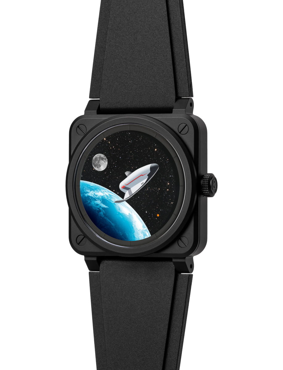 Side view of Bell & Ross wristwatch with black ceramic case, black rubber strap, and dial with black aventurine plate representing space