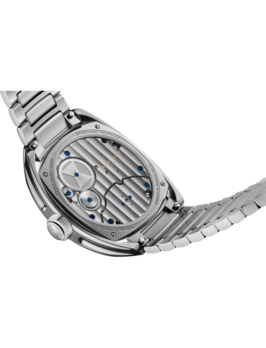 Back of a silver wristwatch showing its mechanical movement with gears, blue screws, and striped engraving on the case back.