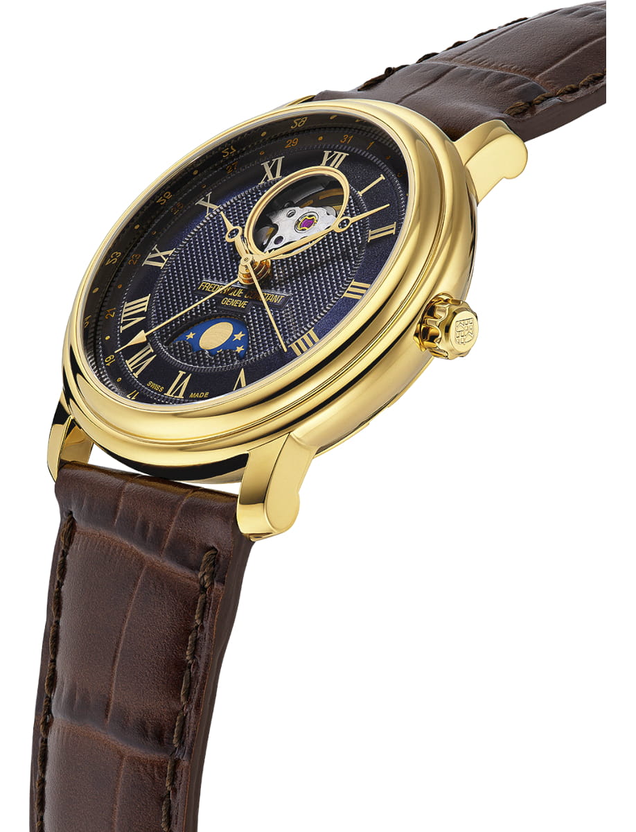 Gold-tone wristwatch with a blue dial, Roman numerals, and an open-heart balance wheel, featuring a moon-phase indicator on a brown leather strap