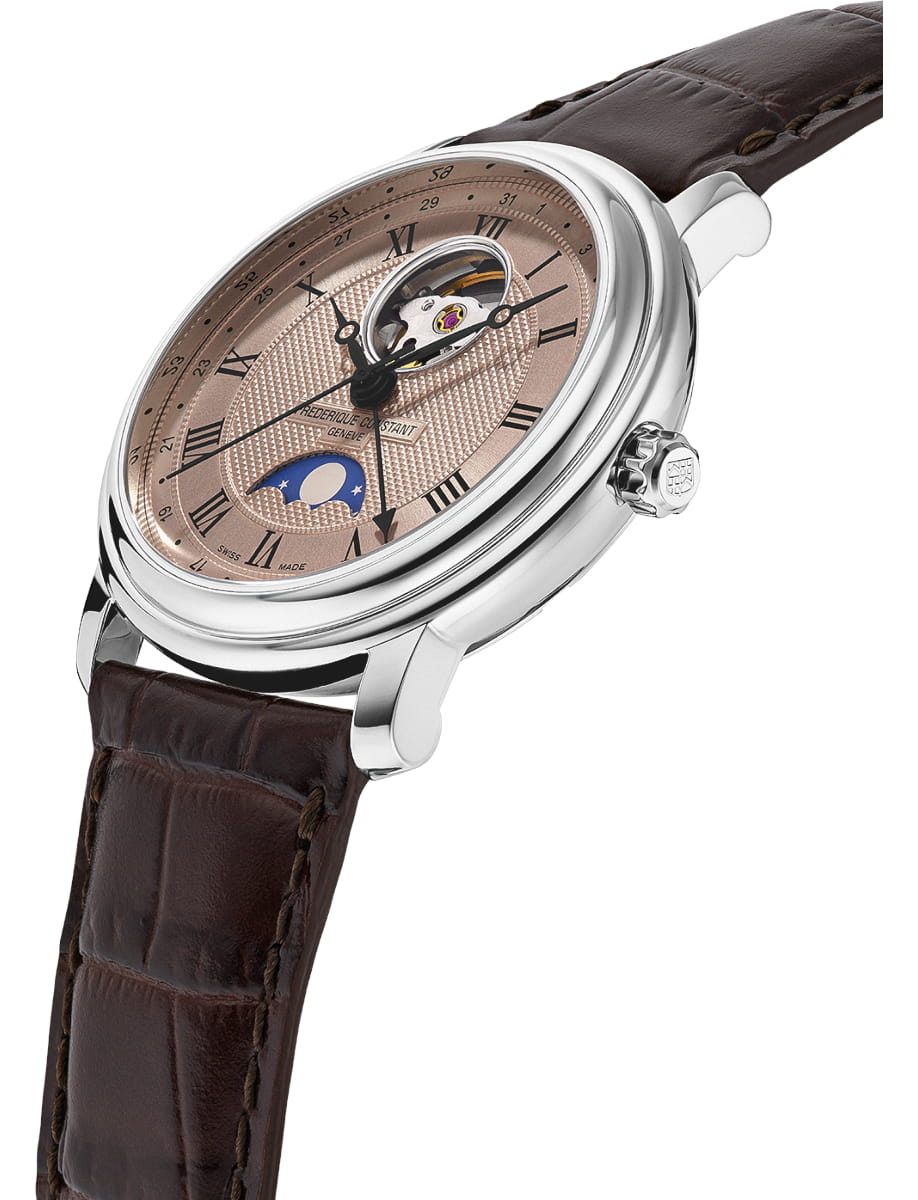 Luxury wristwatch with a rose dial, open-heart movement, moon phase display, and brown leather strap. (Close-up)