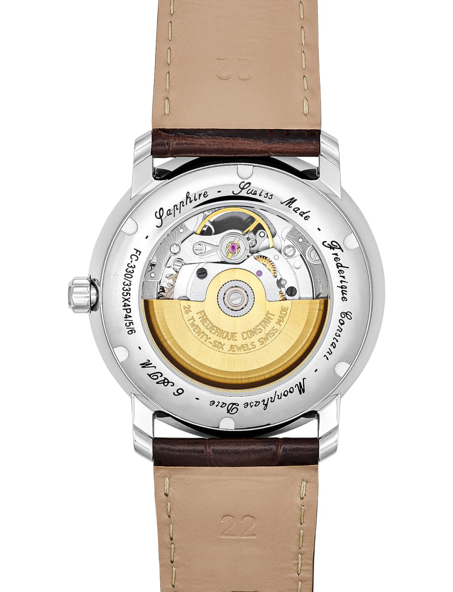 Transparent case back of a Swiss-made automatic watch revealing gears and gold rotor, with brown leather strap nearby.