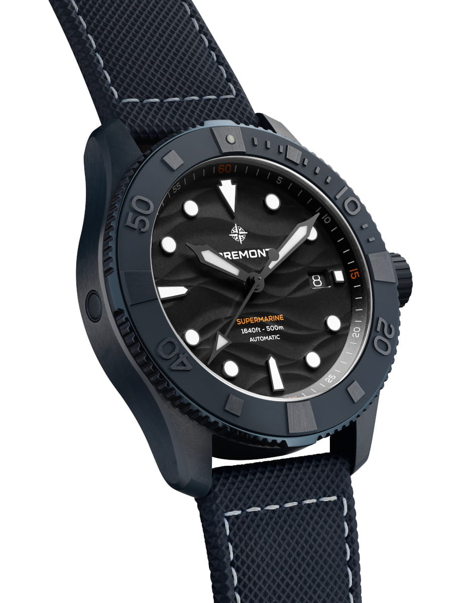 Side view of Bremont Supermarine ceramic watch with a textured blue strap and dark blue bezel, black patterned dial and white hour markers