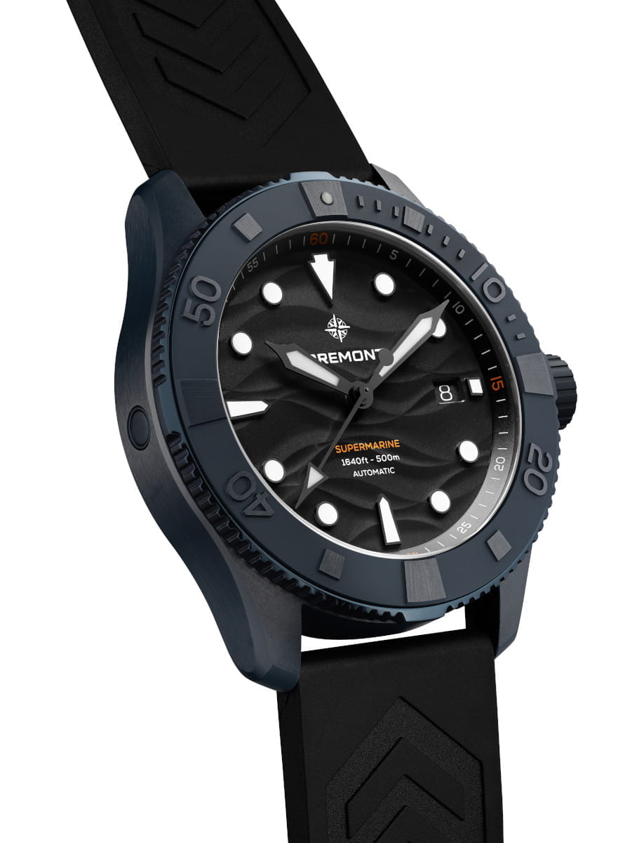 Blue ceramic Bremont Supermarine watch with a unidirectional rotating bezel, black dial with white markers, date window, and black rubber strap.