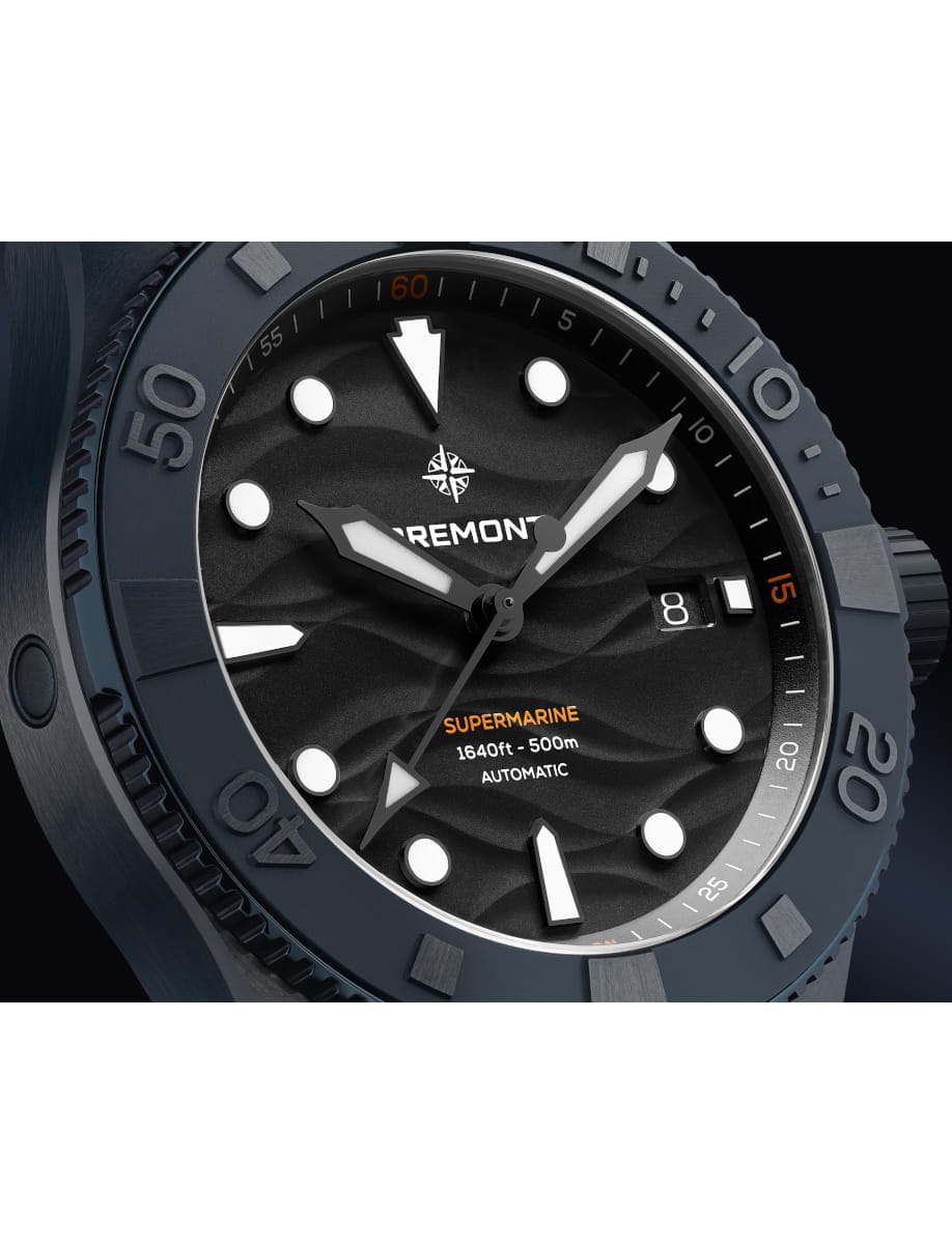Close-up of a Bremont Supermarine diving watch with ceramic case, black dial, and a date window at 3 o'clock.