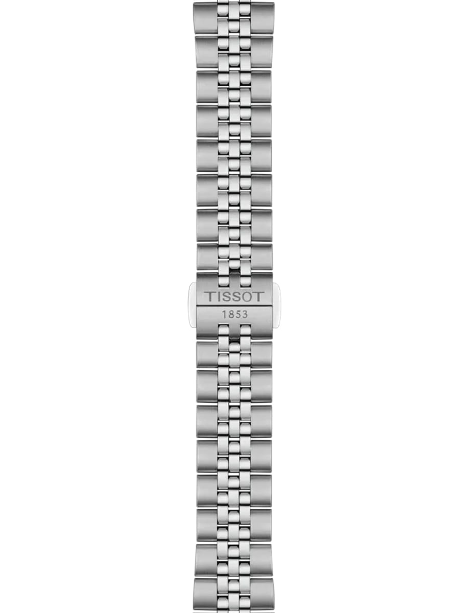 Close-up of a stainless steel watch bracelet with a deployant clasp engraved 'TISSOT 1853'